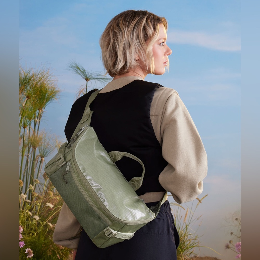 Like new CALPAK Terra sling bag in color juniper